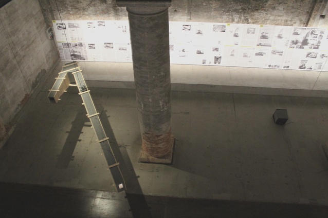 Newspaper clippings of the controversial Herzog & de Meuron project fill the walls.