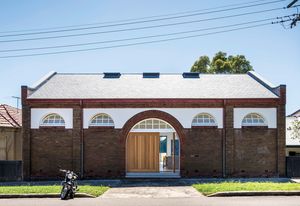 The original drill hall, built between 1904 and 1906, has been imaginatively restored and recast as a sophisticated three-storey home.