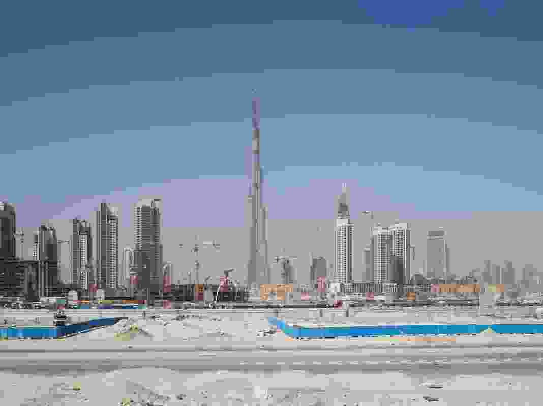 Highrise construction in Dubai, UAE, where much of the architecture is designed from afar, with little connection to the nuances of place. Juhani Pallasmaa describes it as “almost irresponsible to design buildings in alien cultures.”