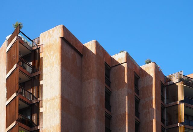 Brick facade of the Apartmentos Girasol by Jose Antonio Coderch (1966) with inspiration from Alvar Aalto.