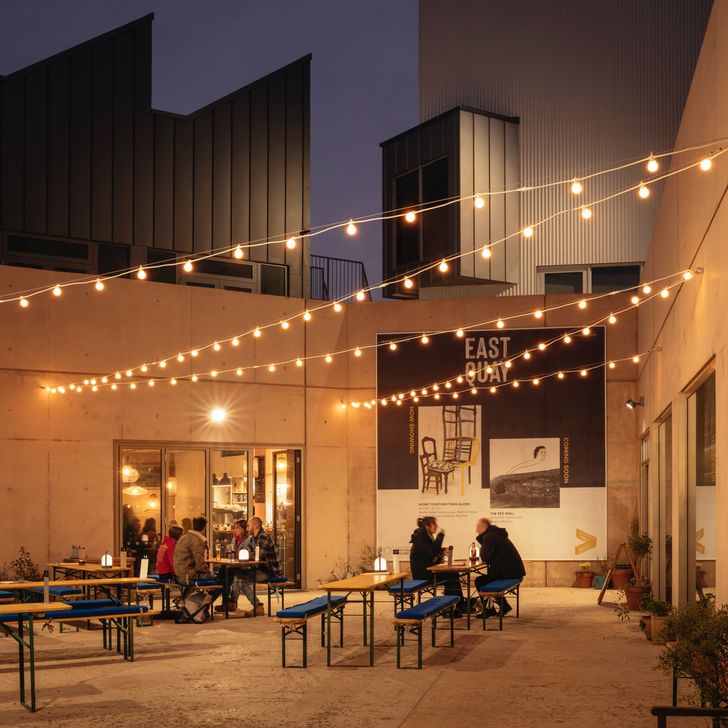 The architectural design of East Quay is designed to foster permeability and flow, encouraging interaction between gallery spaces, maker studios, educational areas, and communal zones.