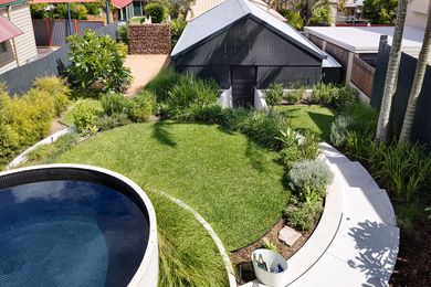 A plunge pool has been created from a concrete water tank craned onto the site and tiled in mosaics.