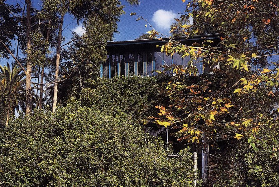 Hank and Julie's own home, 25th Street House in Santa Monica, California, features many moving parts that open it up to the outside. Obscured by landscape, the house only offers glimpses of itself.