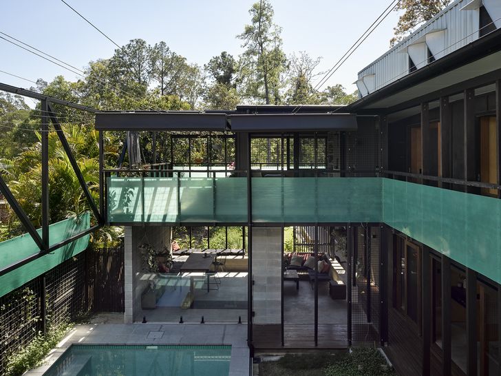 A highly porous main courtyard of Live Work Share House by Bligh Graham Architects.