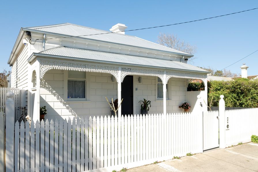 The extension sits behind the classic bullnose facade of this 1860s Victorian cottage in Williamstown.