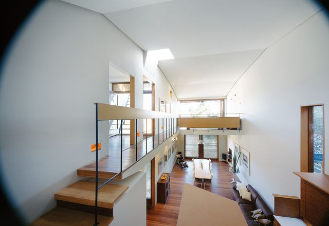 Although the house is small in footprint, the double-height space and connection between levels make it feel larger.