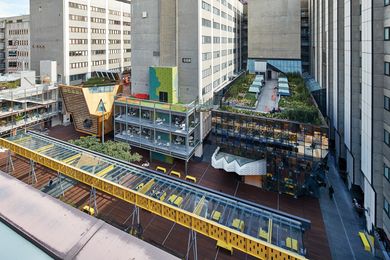 The sober plan and existing buildings are overlaid with a cacophony of colour and architectural expression. Landscape architects TCL created terraces on the rooftops and one at street level, featuring Peter Elliott’s relocated Bowen Terrace Loggia.