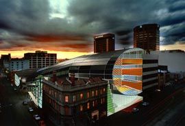 The proposed recreational facilities building, by Lyons, wraps around an existing Swanston Street building. Image: John Gollings