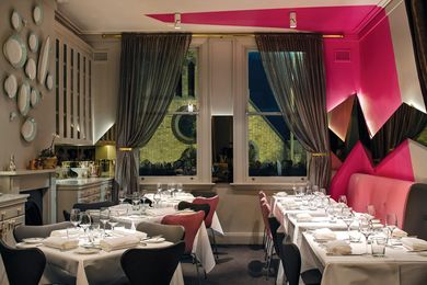 The upstairs dining room retains its opulence and gains a graphic signature.