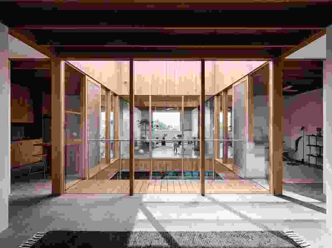 The glazed courtyard enables visual connection between living spaces.