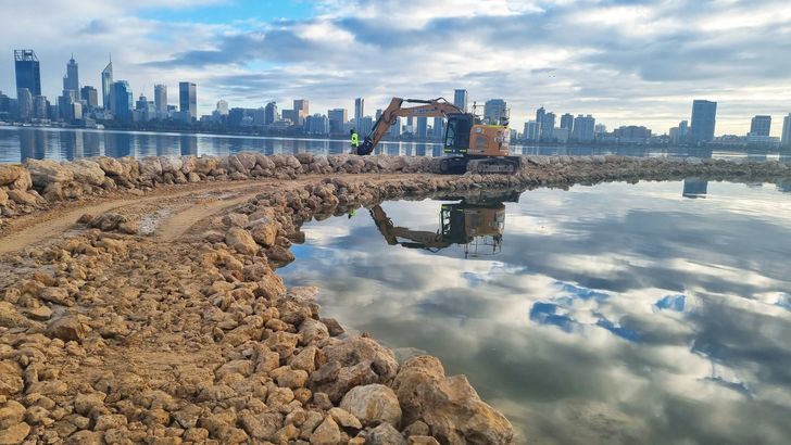 A bobcat shapes the sand and rock of Djirda Miya island during the construction process in 2020. Photo: City of South Perth.