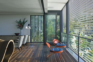 Bifold doors open the living room to a loggia overlooking the harbour.