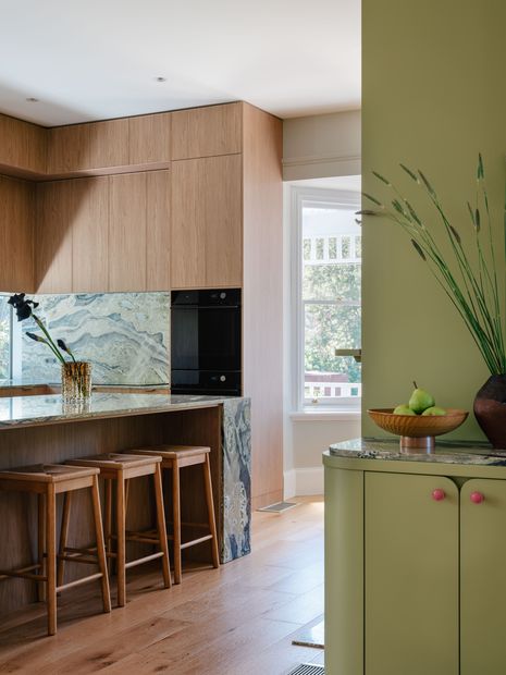 Kitchen joinery features a warm oak timber-grain finish.