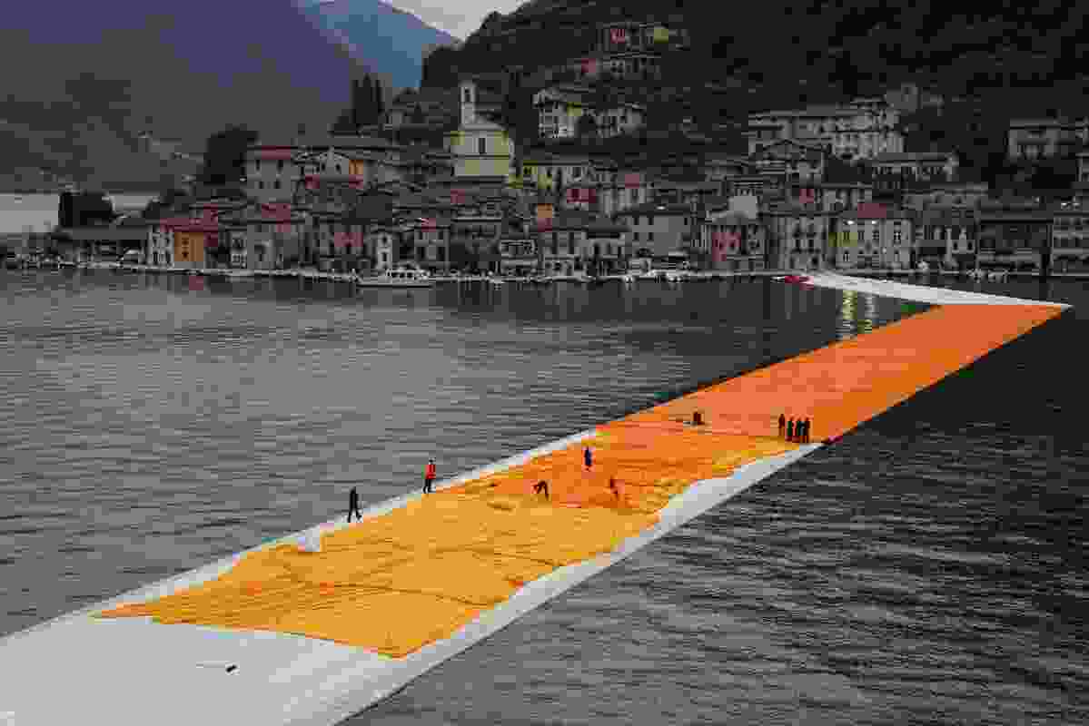Over two days teams unfurled 100,000 square metres of shimmering dahlia-yellow fabric on the piers and pedestrian streets in Sulzano and Peschiera Maraglio.