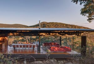 In the dining and sitting spaces, solid walls give way to operable glazed panels that allow the pavilion to be transformed into a platform.