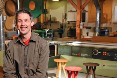 George Harper in his studio, with La Paz side tables/stools.