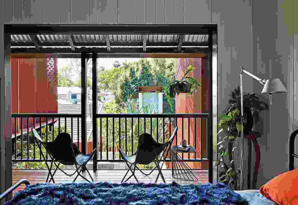 The canopy of the outdoor room provides shade and outlook to the first-floor bedrooms.
