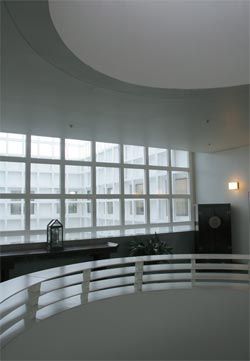 The main central void, looking
from level 1 out into the glazed internal courtyards.
Photograph Ben McMillan.