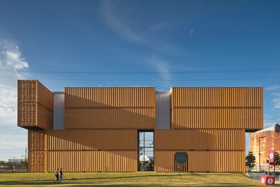 What might have been a rigid grid is animated by the simple gesture of shifting the top two containers across the facade.