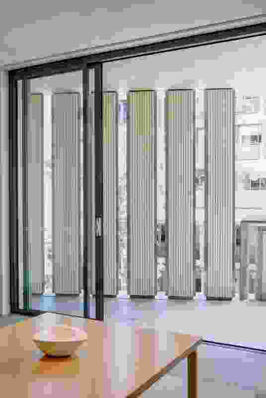Screens are used to maintain privacy in the tight matrix of apartments on narrow streets.