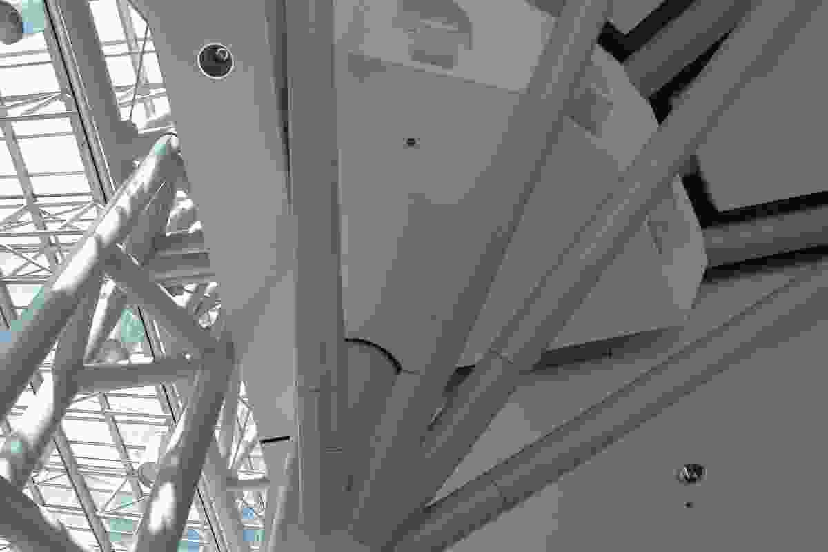 Concealed bolted connections have been used to join the round HSS members of this truss to the column connection of a large atrium.