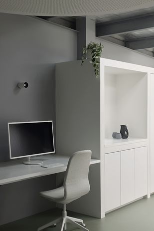 Upstairs workspaces are minimal and flexible.