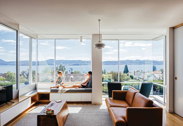 An engaged column caps off an integrated window seat and delineates two cosy sitting spaces looking over Sandy Bay.