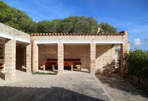 A series of pavilions connected by courtyards.