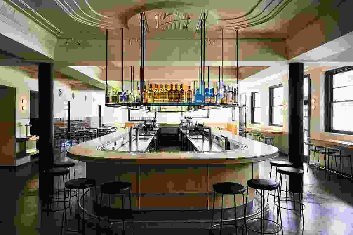 In the public bar, the iconic rainbow pride flag has been abstracted in the iridescent colours of dichroic glass above the bar.