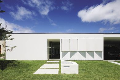 The spare horizontal profile of the street facade of this “camping house.”