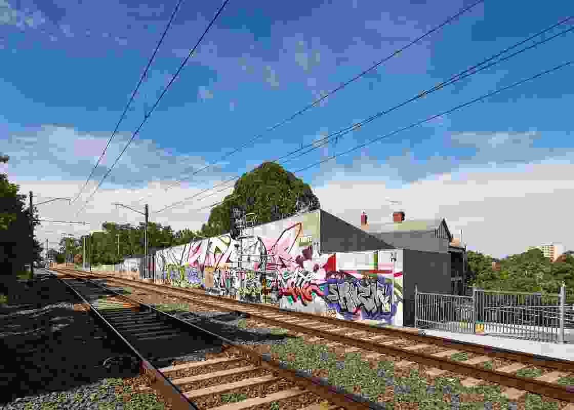 The railway side of the forty-metre block wall acts somewhat as a billboard and provides a canvas for street art.
