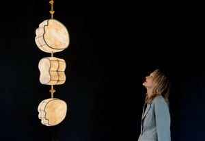 Designer and practice founder Andrea Claire looks up at the large-scale suspended installation, Totemic.