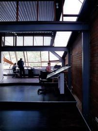 The office space at the south end of the upper level, looking over Onslow Road through the pleated glazing of the upper level facade.