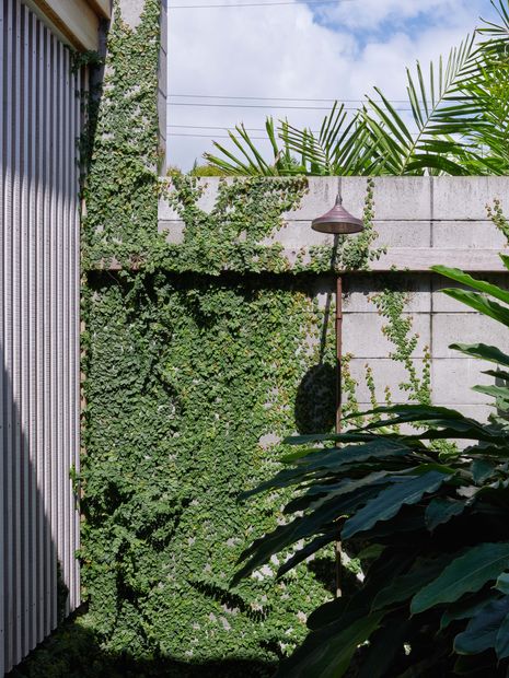 An outdoor shower in the private courtyard garden is a spot to hose off after the beach.