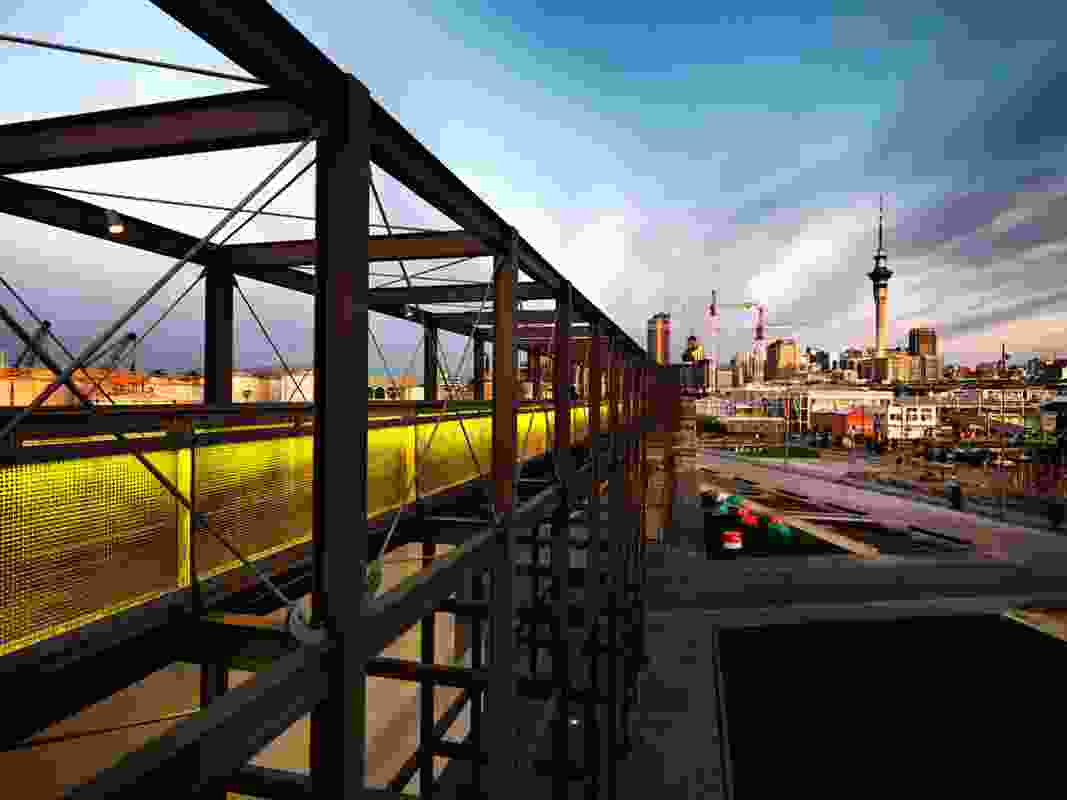 The gantry at dusk looking back to the city. Large colourful buoys at the base of the structure will eventually form part of a new playground.