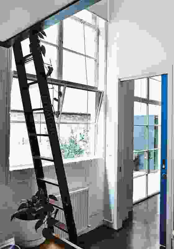 In one private office, a ladder steps up to a neat loft that takes advantage of the 4.5-metre ceilings.