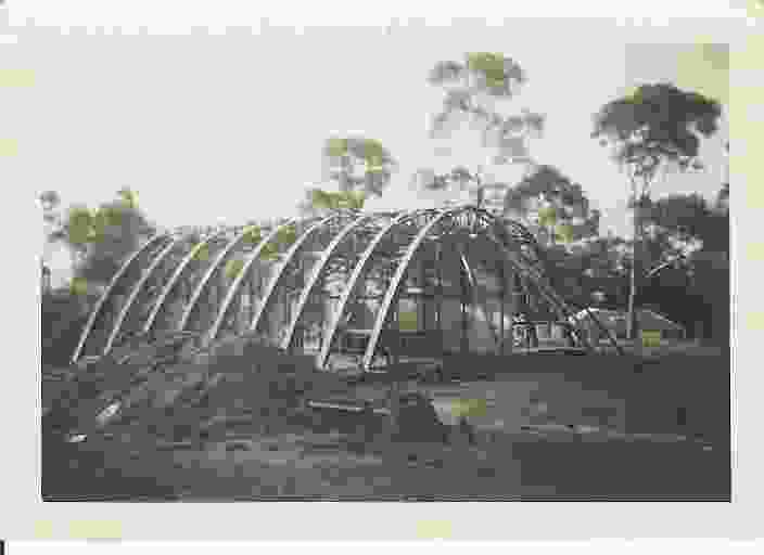 The Rice House by Kevin Borland under construction, showing catenary timber arches.