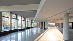 The first floor of the entry building houses the long gallery and a conference space.