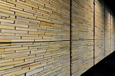 Discarded books live anew as a wall in Deakin Waurn Ponds Library by Six Degrees Architects.