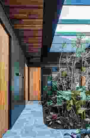 The home’s sequence of internal gardens and courtyards is a nod to tropical modernism.