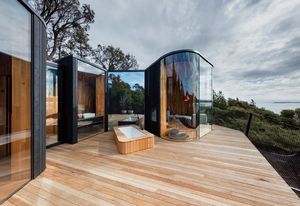The living and sleeping arms of each pod embrace a private deck, providing shelter and privacy.