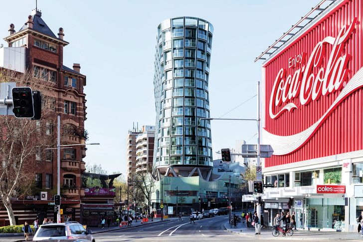 The Omnia apartment building (2019) is a defining anchor for a major Kings Cross intersection.