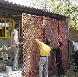 Installing a screen at a bholu preschool by Architects Without Frontiers, Ahmedabad, India.