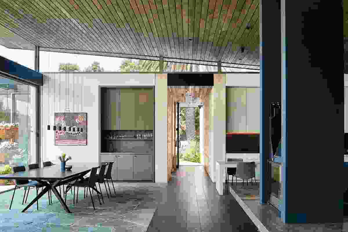 Stone paving extends into the living pavilion, emphasizing a connection between indoors and out. Artwork: Nellie Marks Nakamarra.