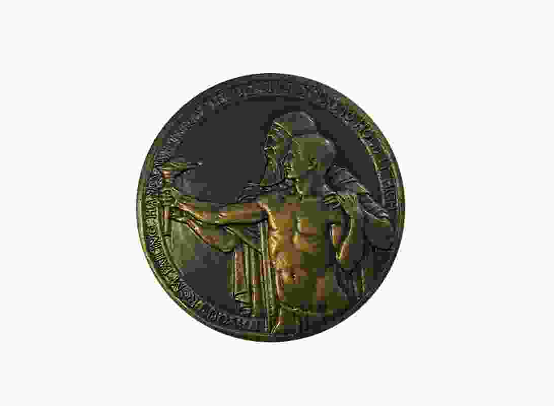 The 1924 version of the medallion shows a robed, bearded elder passing a torch to a young man clad only in a loin cloth. The updated 2006 version retained the image.