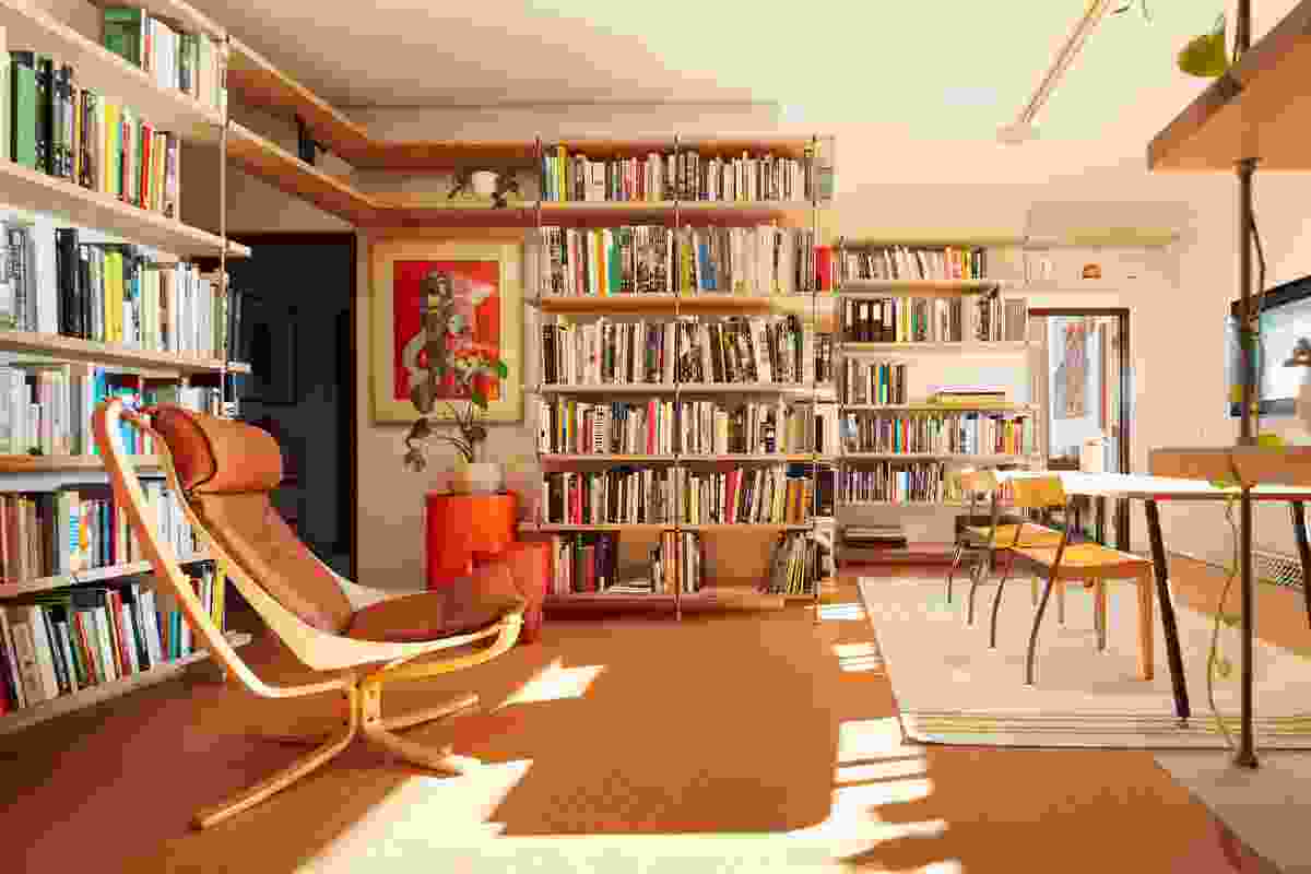 The bedrooms are oriented around a large library on the first floor. Artwork: Antony Muia.
