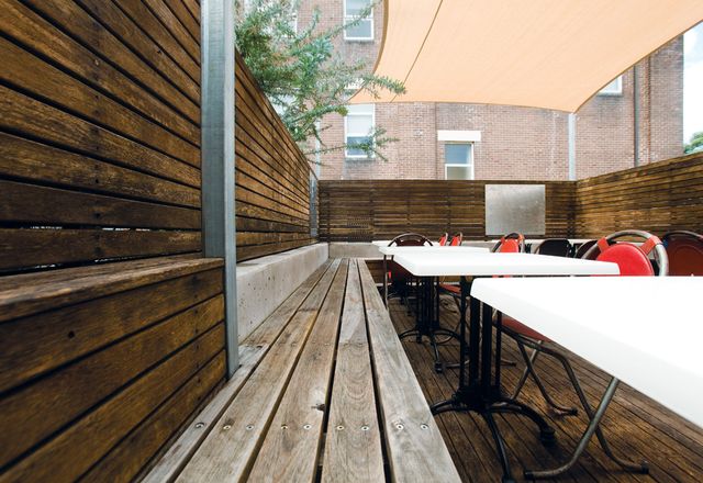 The outdoor deck dining features reclaimed timber benches.