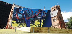 Callum Morton’s billboard shows St Georges Cathedral as a roller-coaster ride.