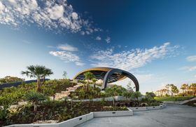 The core of the Home of the Arts (HOTA) stage and theatre spaces reside beneath a “mountain” landscape made up of succulents, rainforest species and grasses from the wider Gold Coast region.