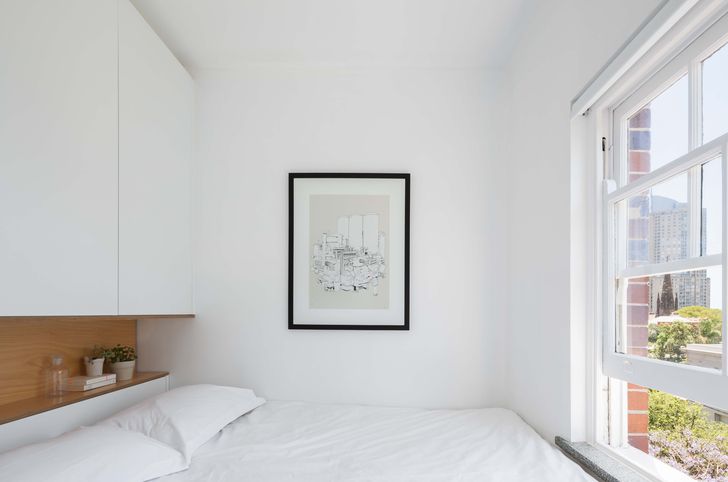 Located in the former kitchen, the new bedroom is gifted with the best outlook. Artwork: Blu.